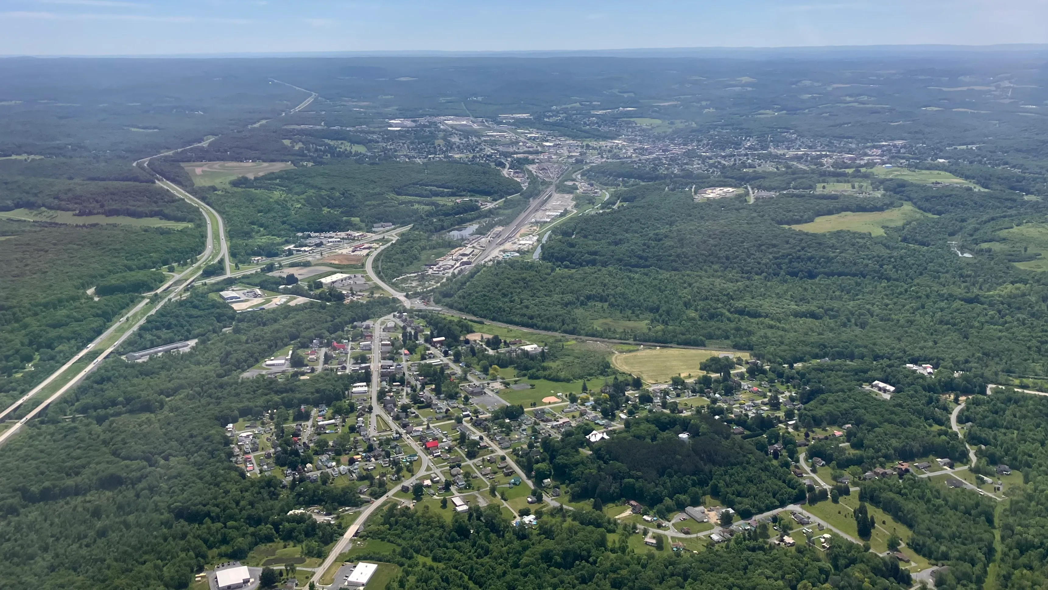 Aerial view of DuBois, Pennsylvania in summer, with Interstate 80 running through the valley